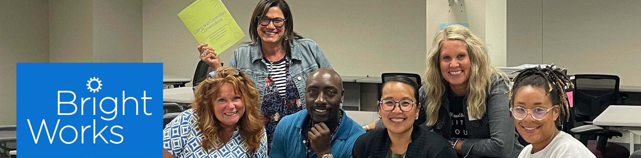 A diverse group of teachers working together at a training